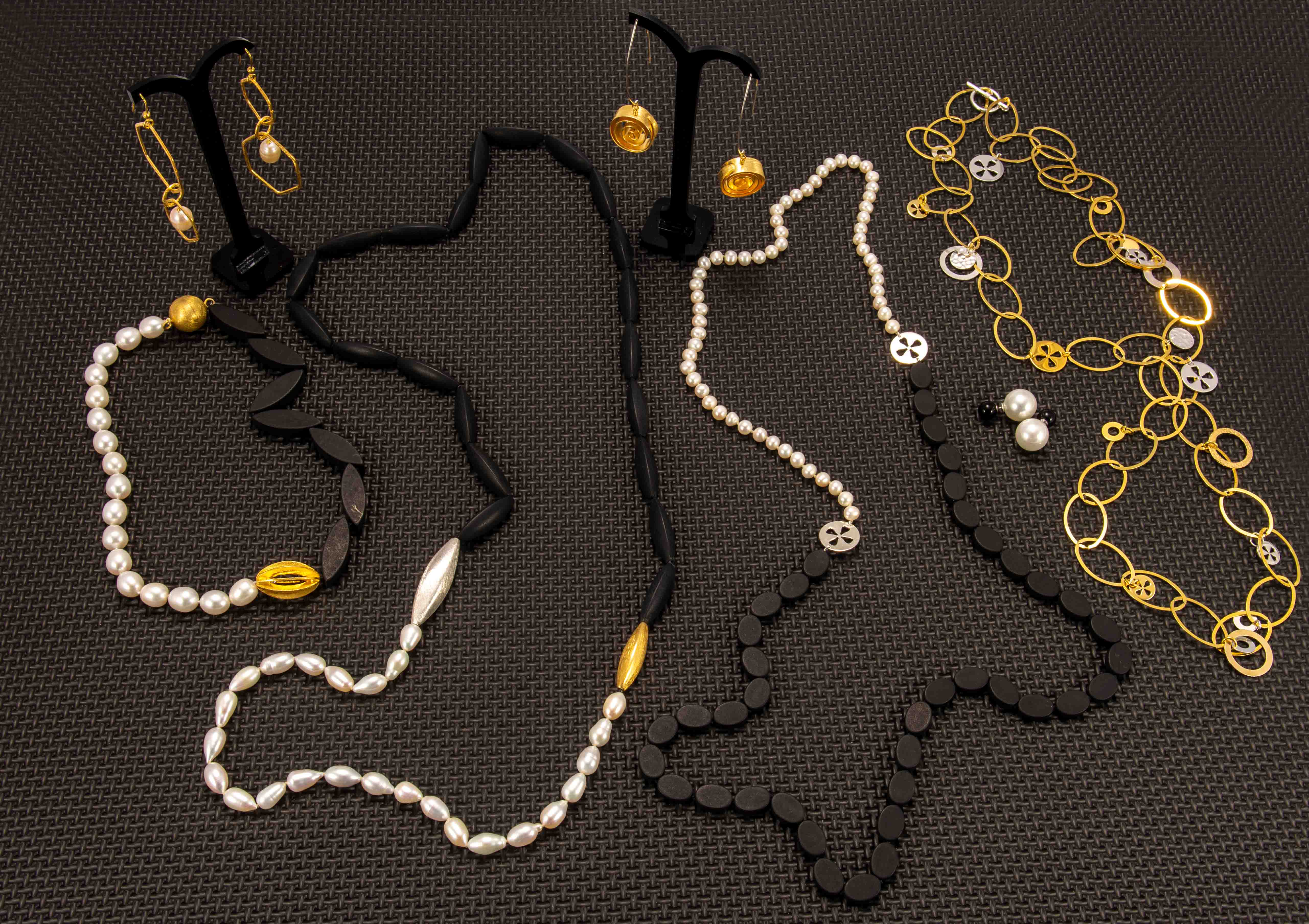 A-selection-of-silver-gold-vermeil-onyx-and-pearl-jewels-by-Kohatu-Petros