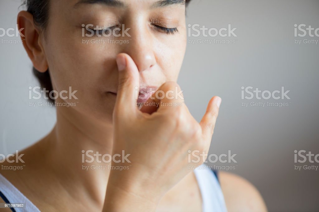 Young attractive woman doing breath therapy.